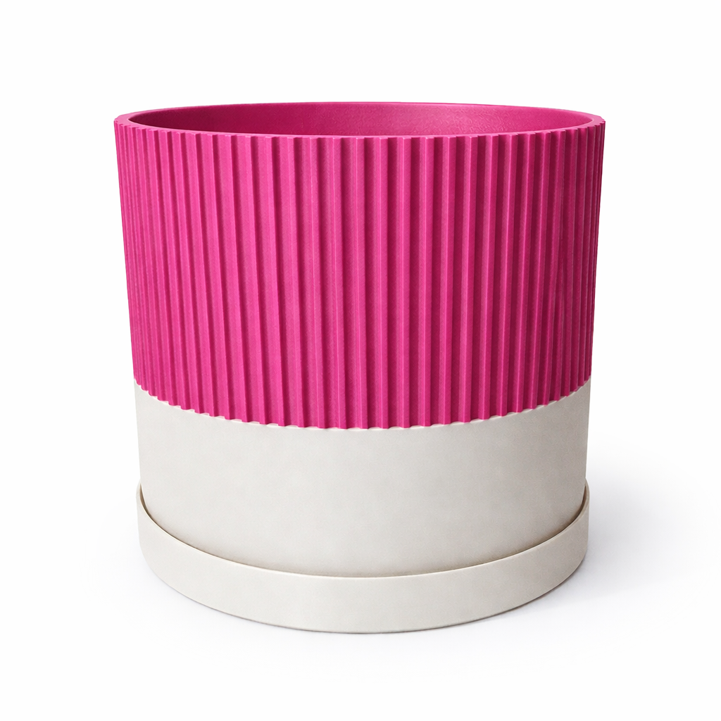 Pink and beige ribbed planter on a white background